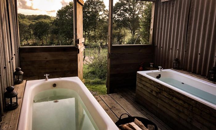 Two baths set side by side under the sky.